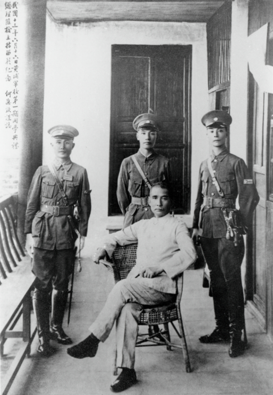 Dr. Sun Yat-sen (seated) and Whampoa Military Academy Commandant Chiang Kai-shek (standing, center) at the opening ceremony on Changzhou Island, Guangzhou, on 16 June 1924.