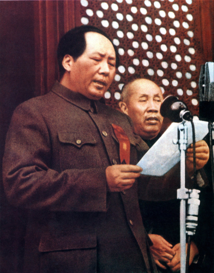 Chairman Mao Zedong reading the proclamation of the Central People's Government of the People's Republic of China on the rostrum of Tiananmen Gate before three hundred thousand assembled citizens.